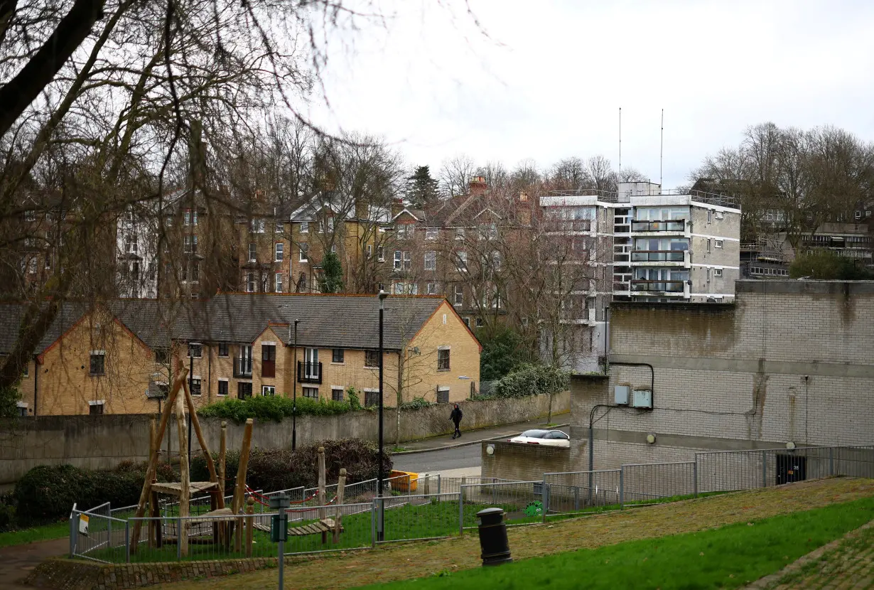 A man walks through a housing estate in south London