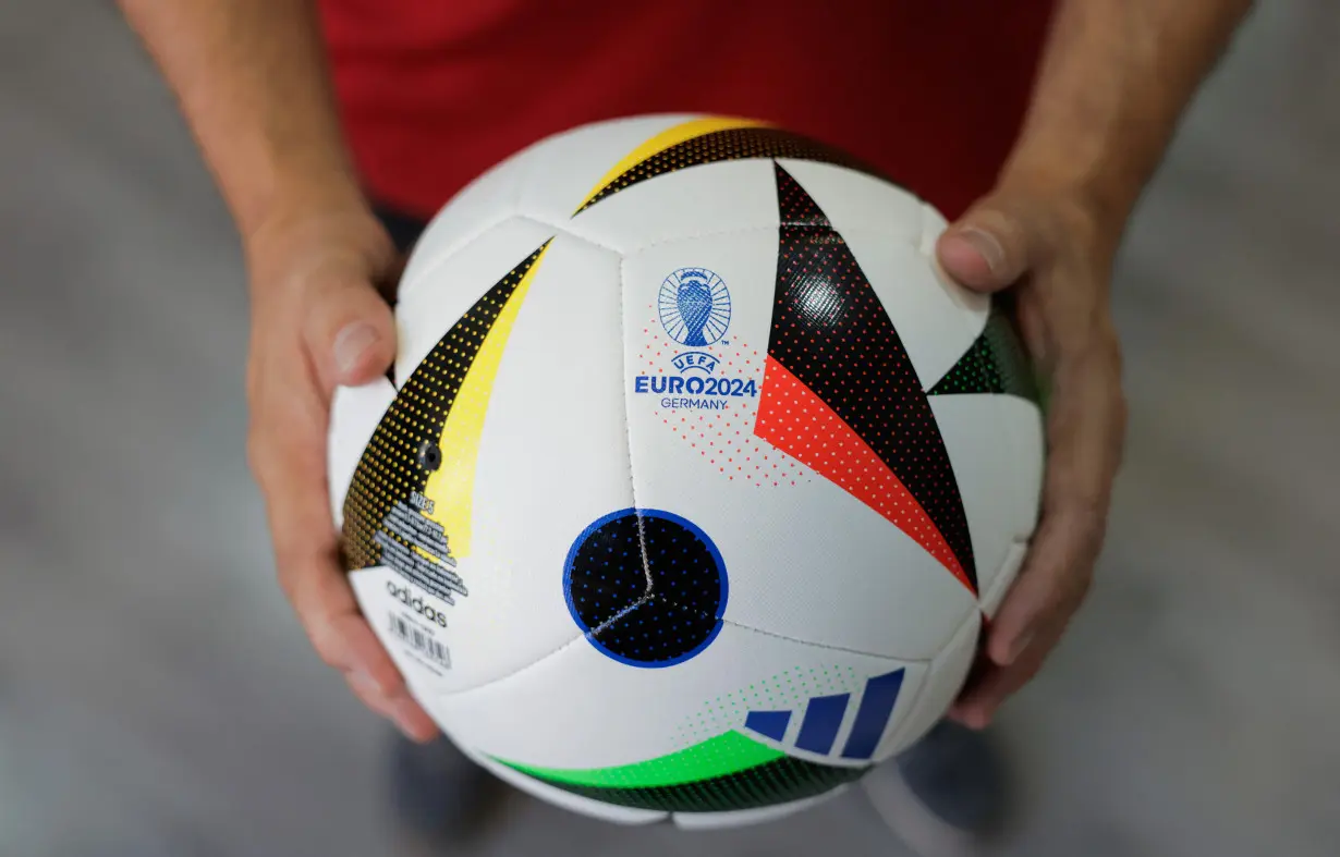 Adidas balls printed as the Euro 2024 match ball 'Fussballliebe' are displayed in Intersport Cary sports clothing store, in Ronda