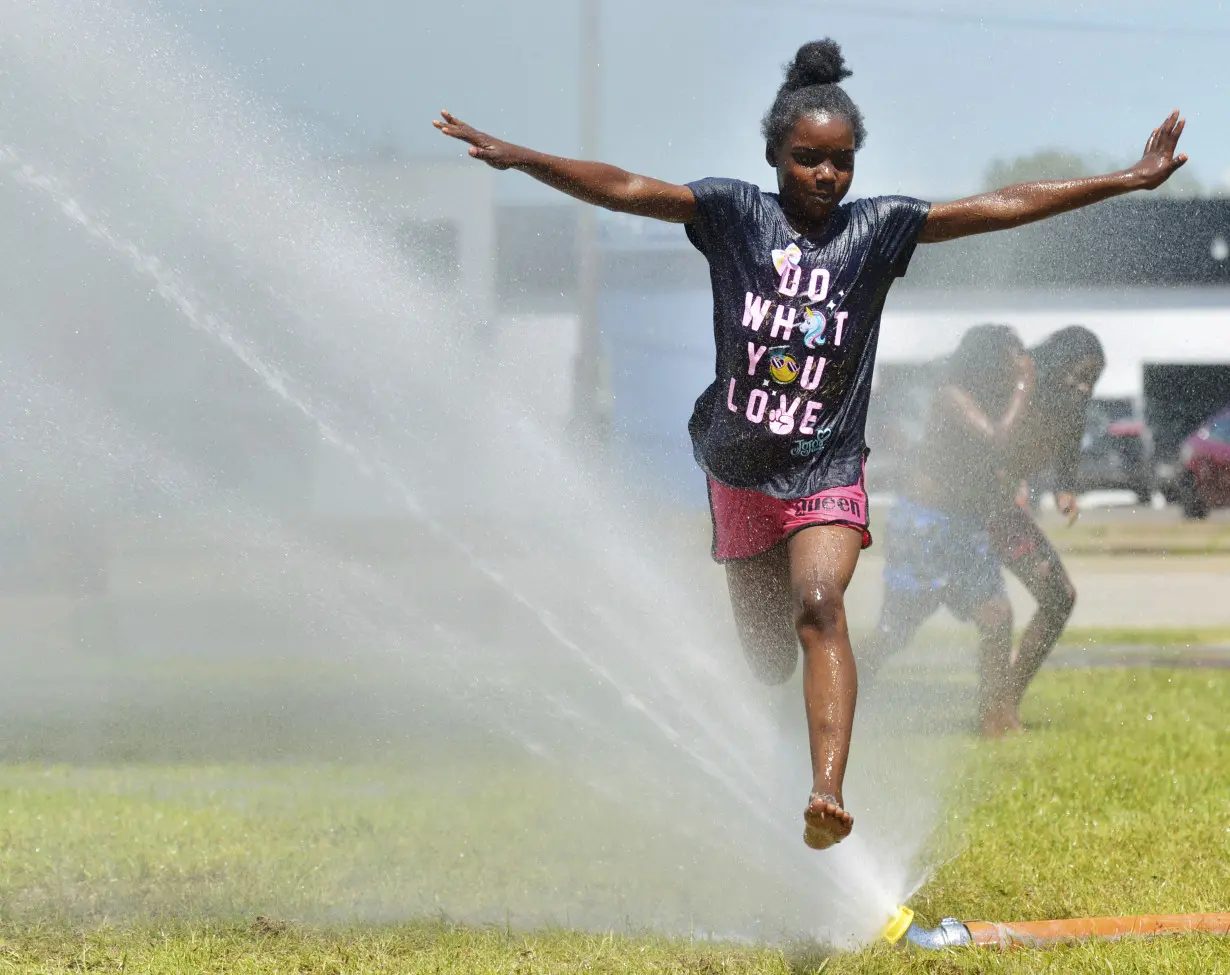 As millions sweat out the heat wave, blocks of lake ice keep these campers cool