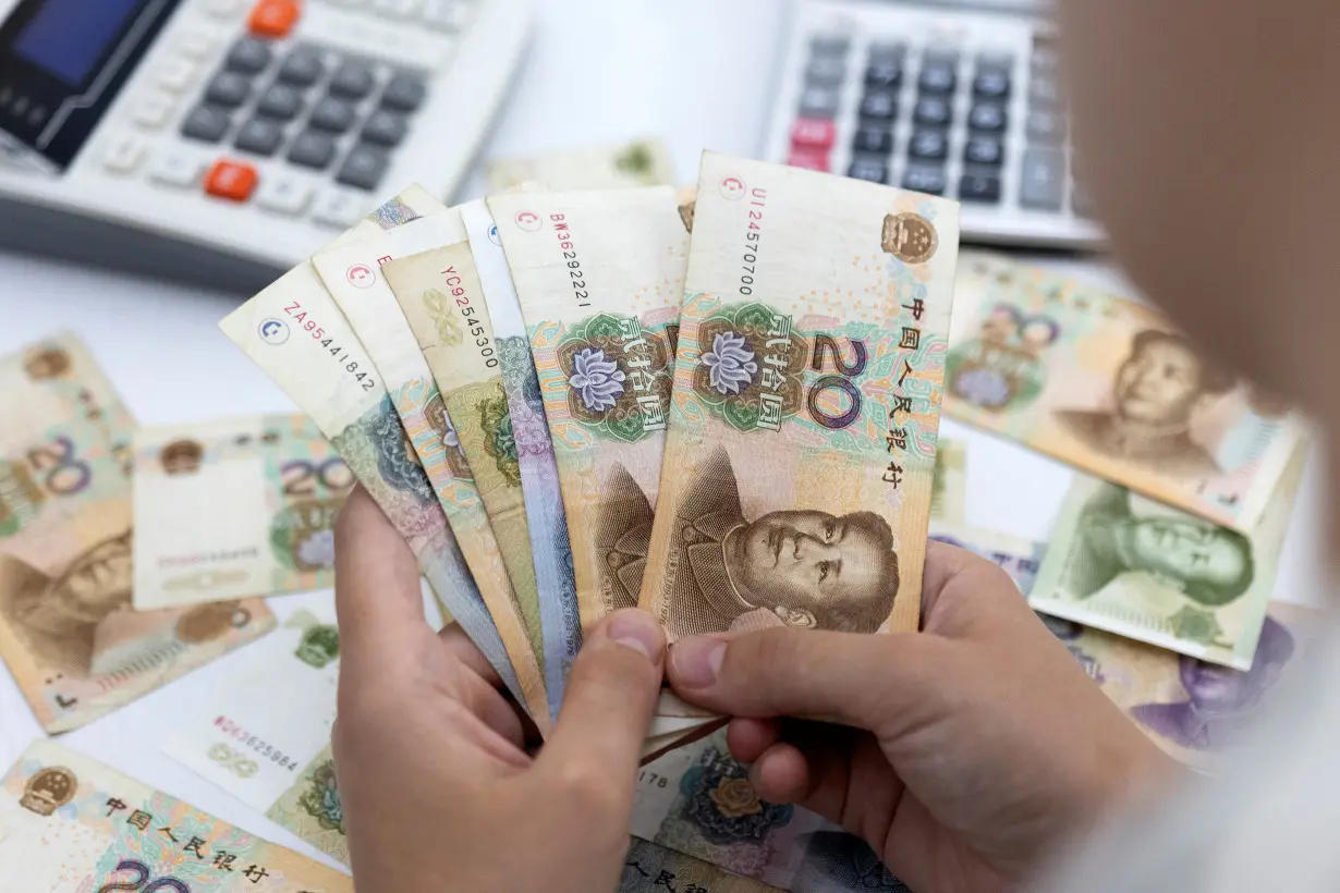 Illustration shows Chinese Yuan banknotes