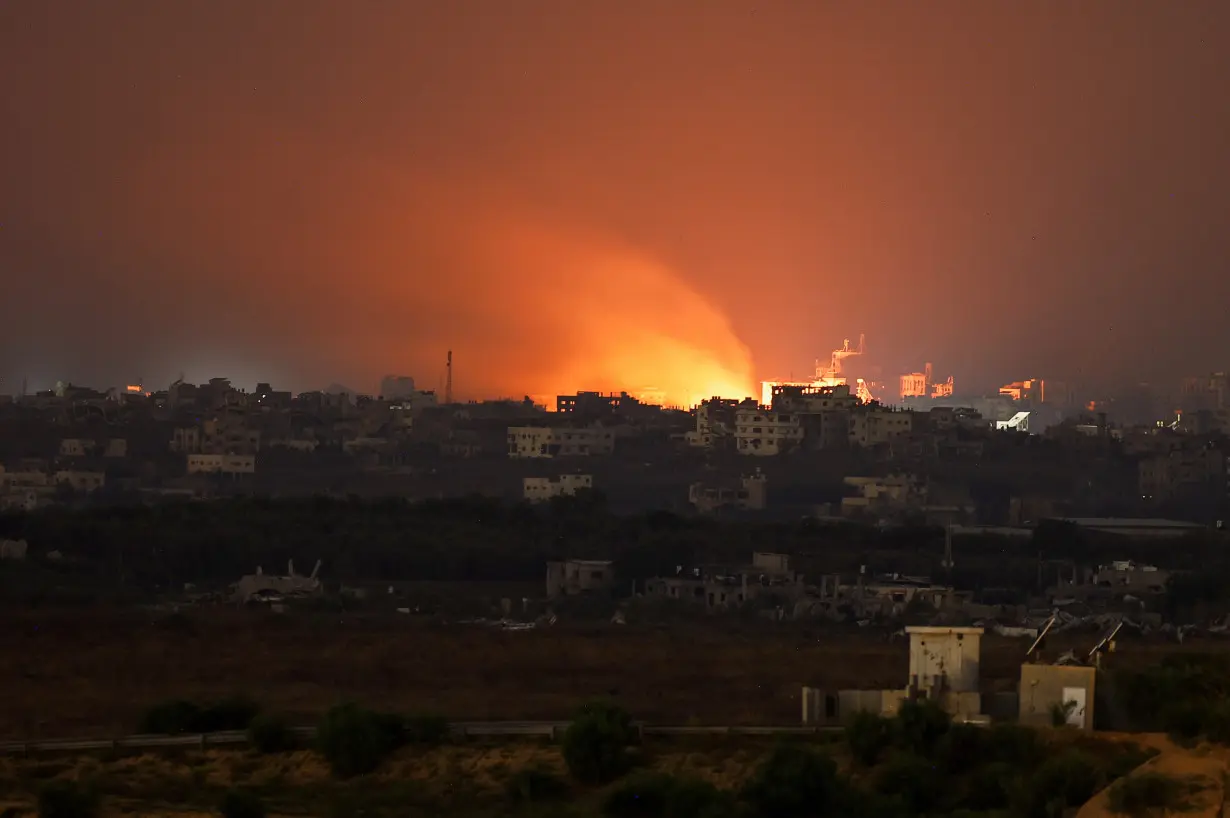 Fire burns in north Gaza, amid the ongoing conflict between Israel and the Palestinian Islamist group Hamas, as seen from Israel