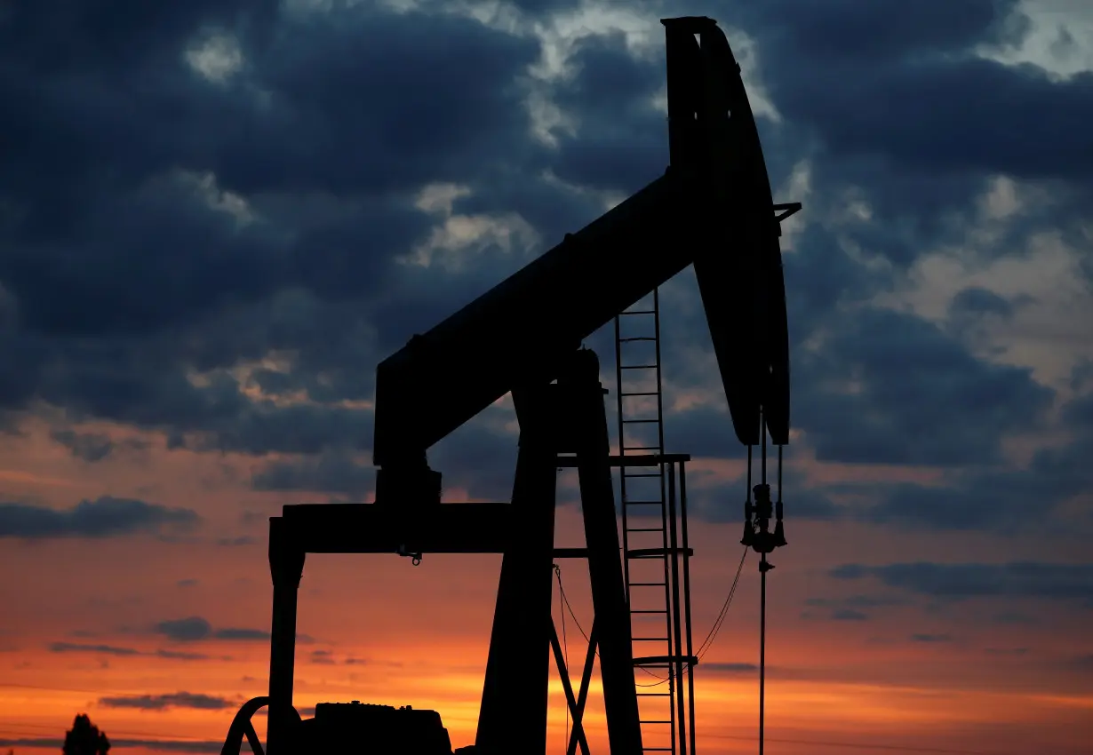 An oil pump is seen at sunset outside Vaudoy-en-Brie