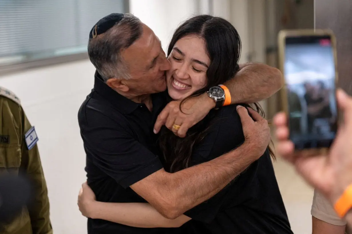 Noa Argamani, a rescued hostage, embraces her father, Yakov Argamani, following her rescue on June 8.