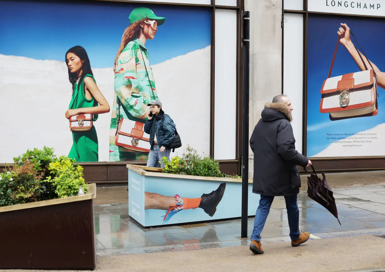 File Photo: People walk on Regent Street in London