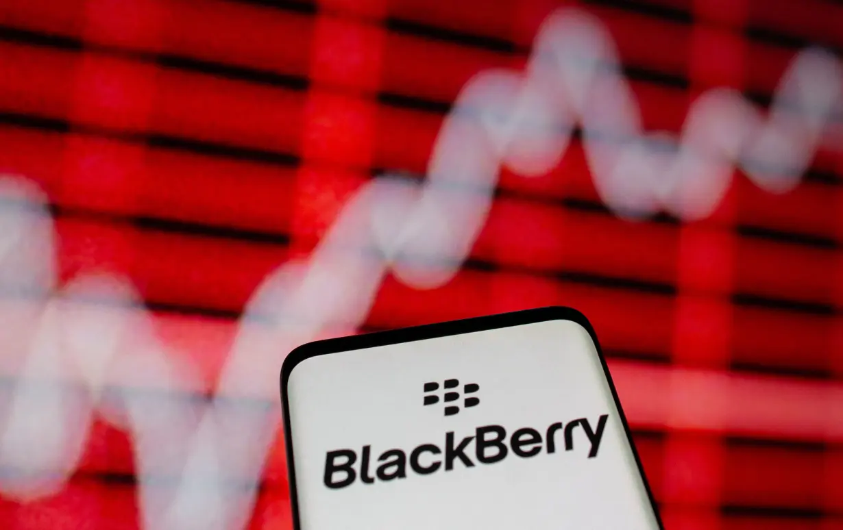 FILE PHOTO: The Blackberry logo is seen on a smarphone in front of a displayed stock graph in this illustration