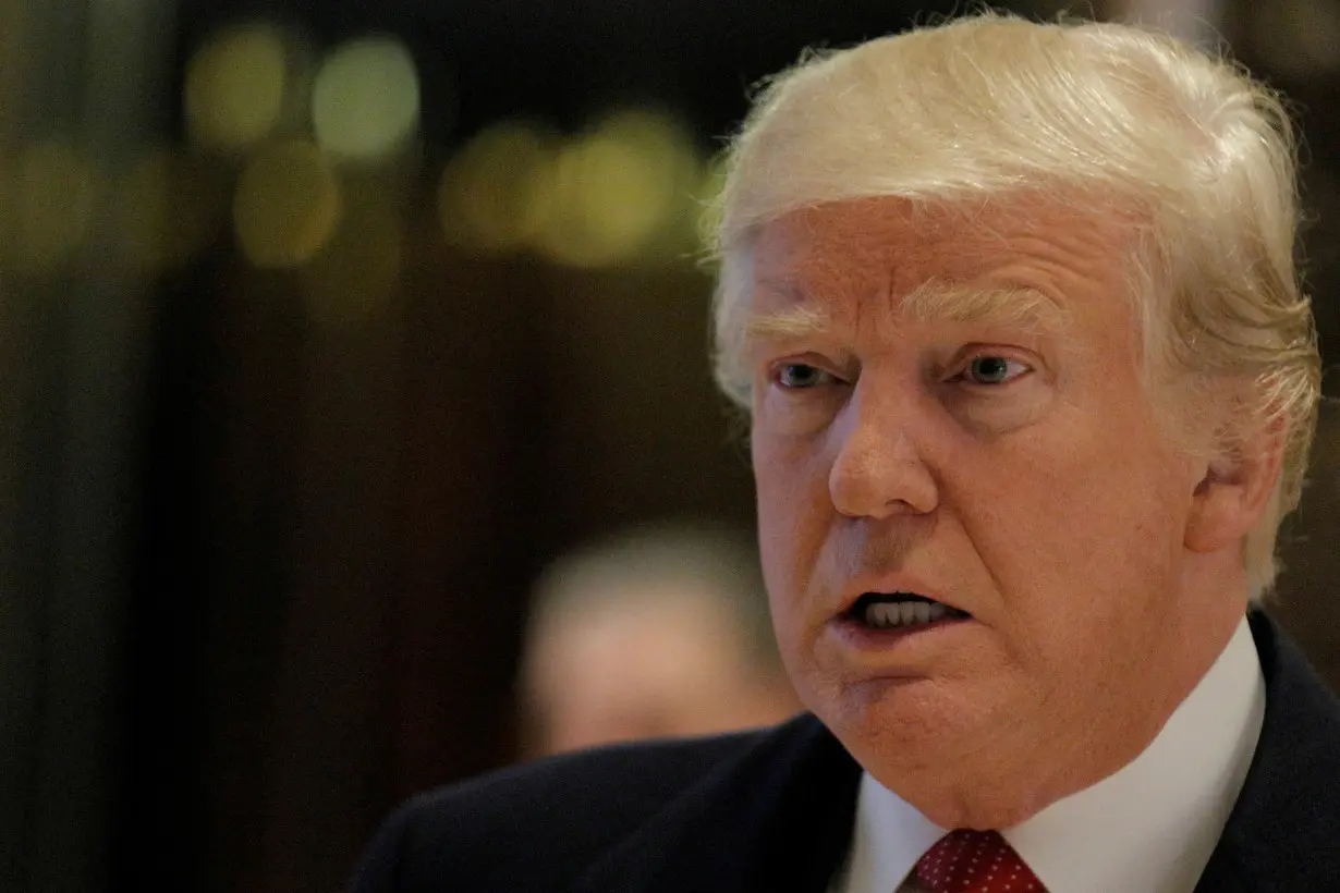 FILE PHOTO: U.S. President-elect Donald Trump speaks to members of the press at Trump Tower in Manhattan, New York