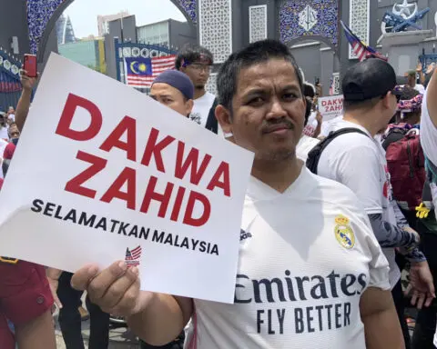 Hundreds protest against the Malaysian government after deputy premier's graft charges were dropped