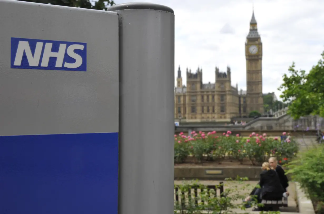 A NHS sign is seen in the grounds of St Thomas' Hospital in London