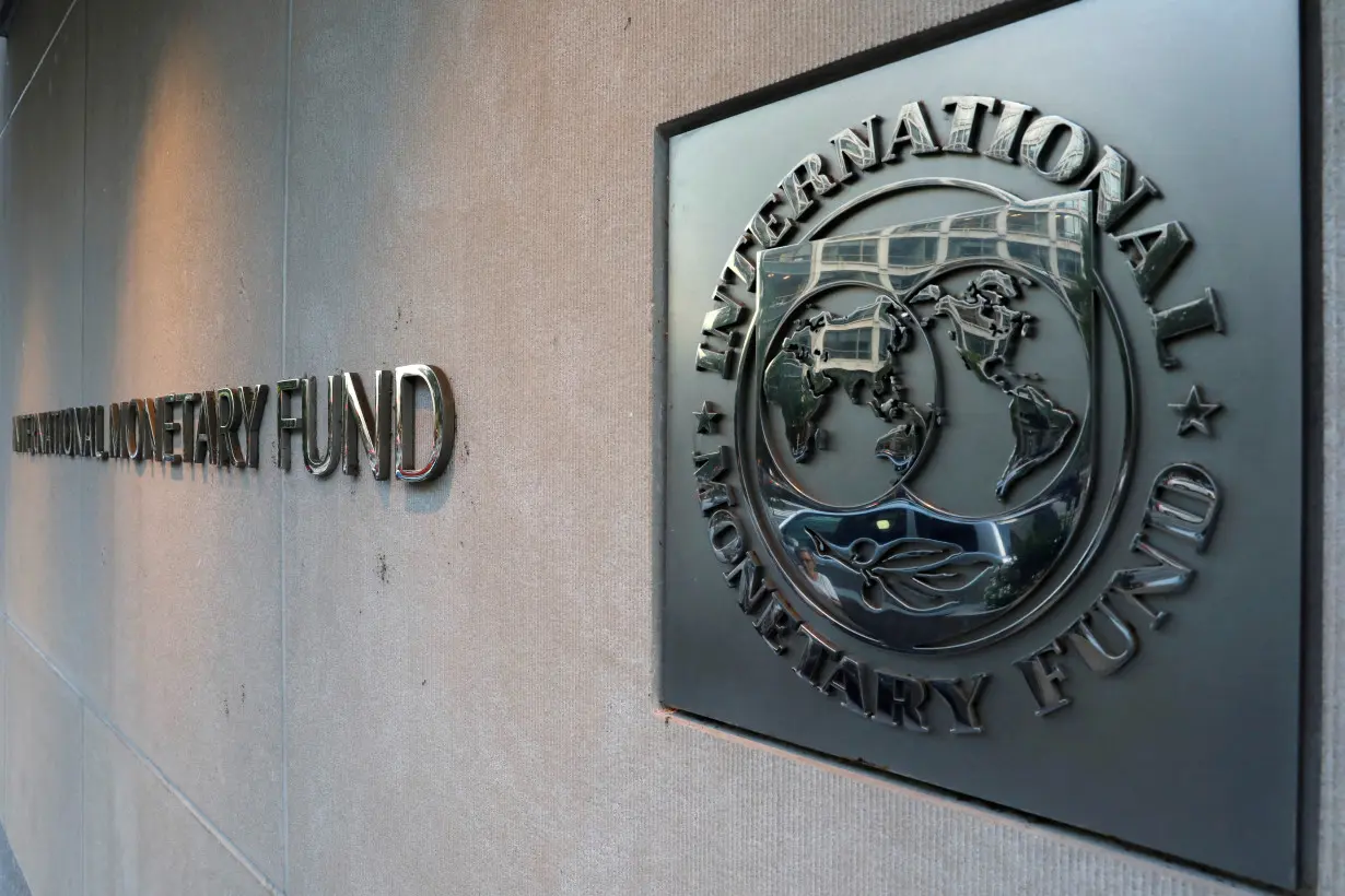FILE PHOTO: The IMF logo is seen outside the headquarters building in Washington