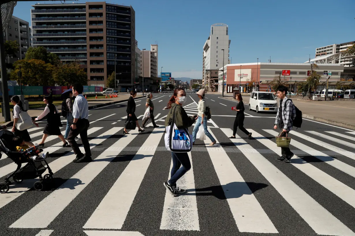 People cross a road in Oita