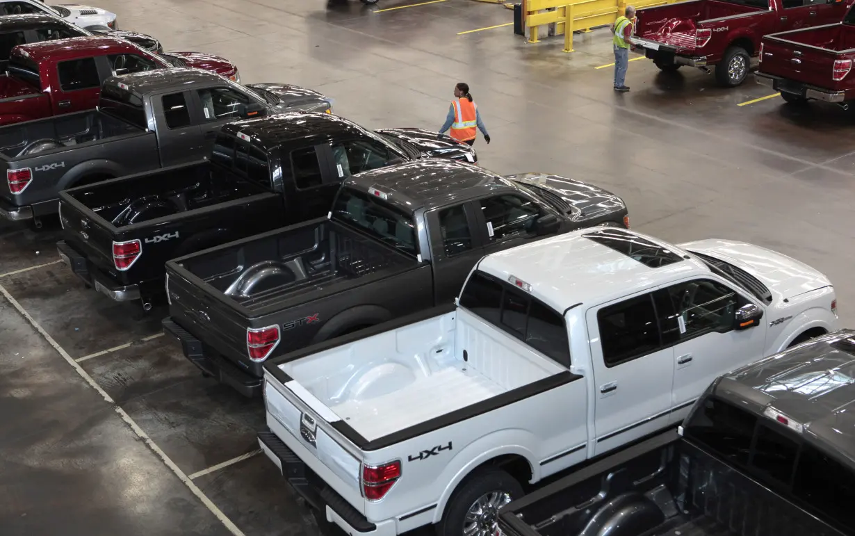 FILE PHOTO: 2014 Ford F-150 pick-up trucks are seen inside the plant at the Ford Motor Dearborn Truck Plant in Dearborn, Michigan