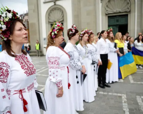 Ukrainian refugees sing Beethoven's 'Ode to Joy' near Swiss summit