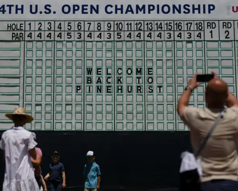 Tiger Woods off early for US Open practice that includes Adam Scott and his major streak