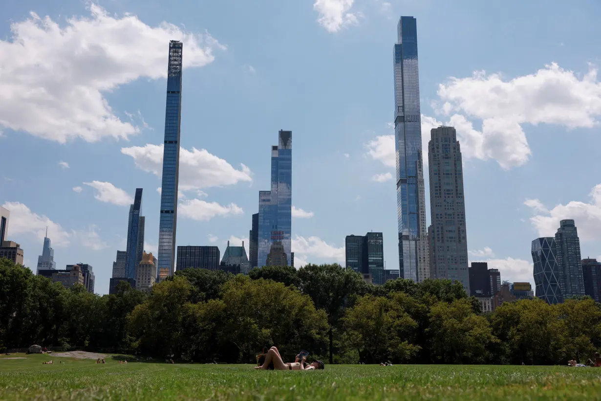 FILE PHOTO: People brave a summer heat wave in New York City