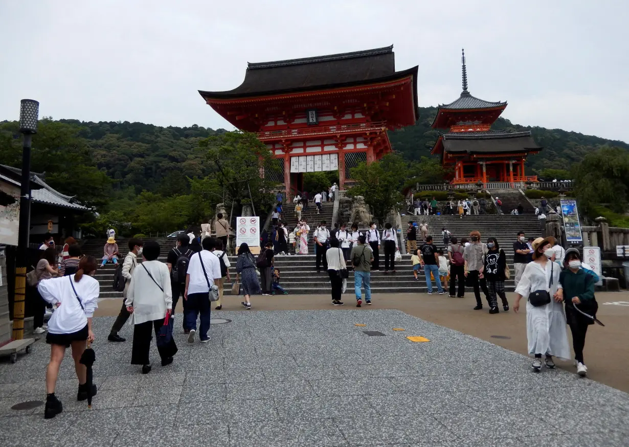 FILE PHOTO: Visitors stroll at Kiyomizu-dera temple, a popular attraction among tourists, in Kyoto