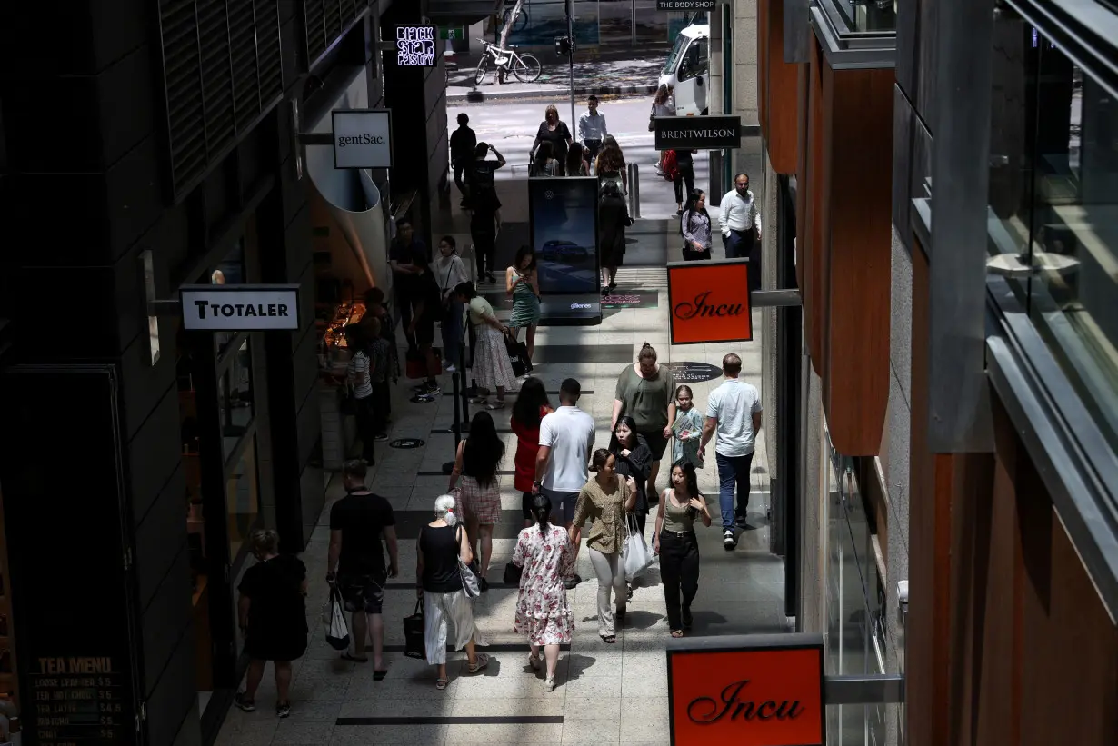 FILE PHOTO: Holiday shoppers are seen in a mall in the city centre of Sydney