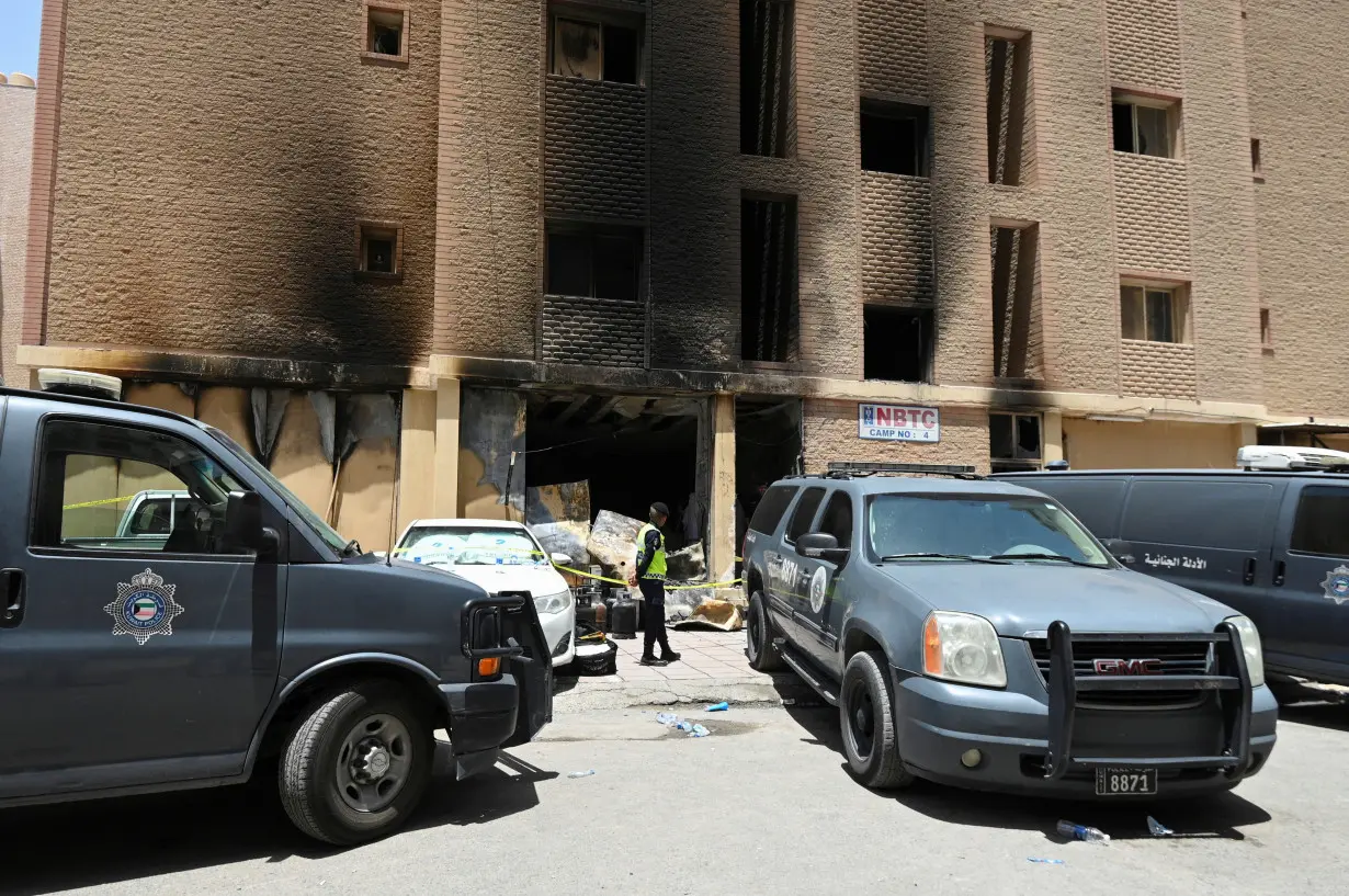 Aftermath of a deadly fire in a building, in Mangaf