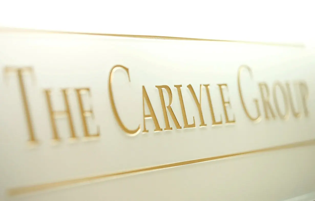 FILE PHOTO: The logo of The Carlyle Group is displayed at the company's office in Tokyo