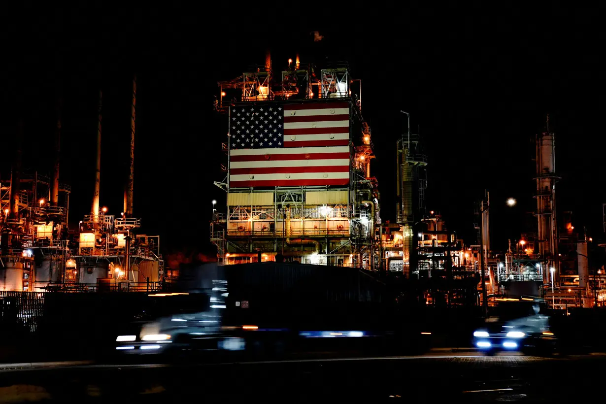 FILE PHOTO: Giant U.S. flag outside Marathon's Los Angeles Refinery in Carson, California