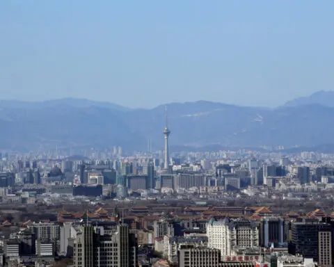 Beijing city cuts home buying costs to boost demand
