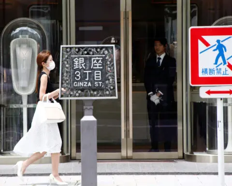 Japan's service activity extends gains, price pressures persist, PMI shows