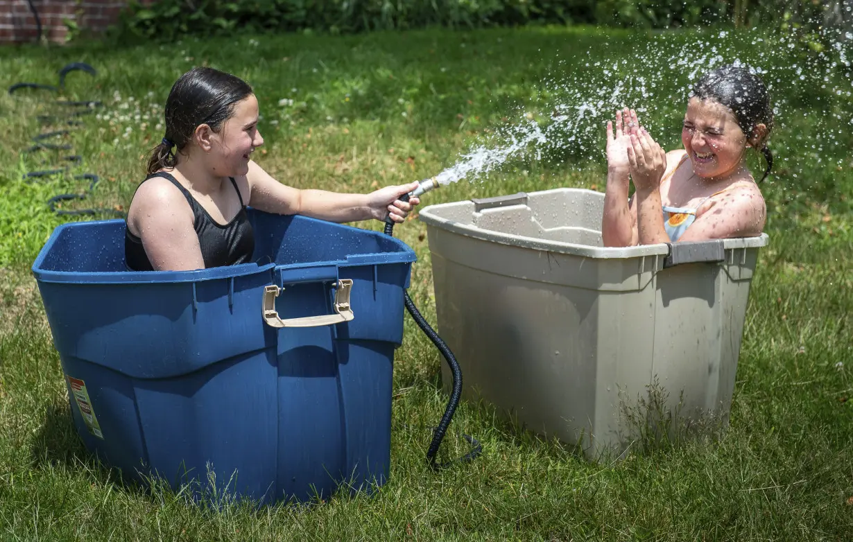 As millions sweat out the heat wave, blocks of lake ice keep these campers cool