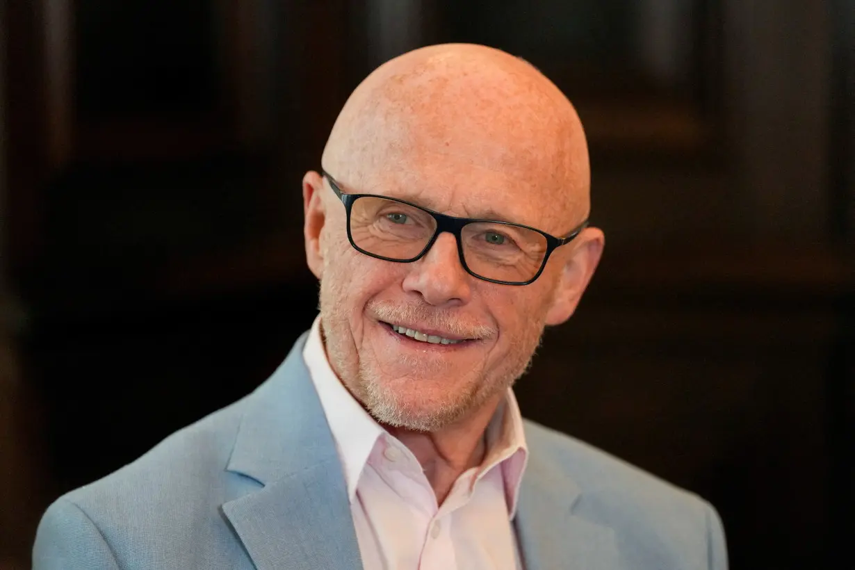 FILE PHOTO: John Caudwell, the billionaire founder of retailer Phones4u, poses for a photograph during an interview with Reuters in London