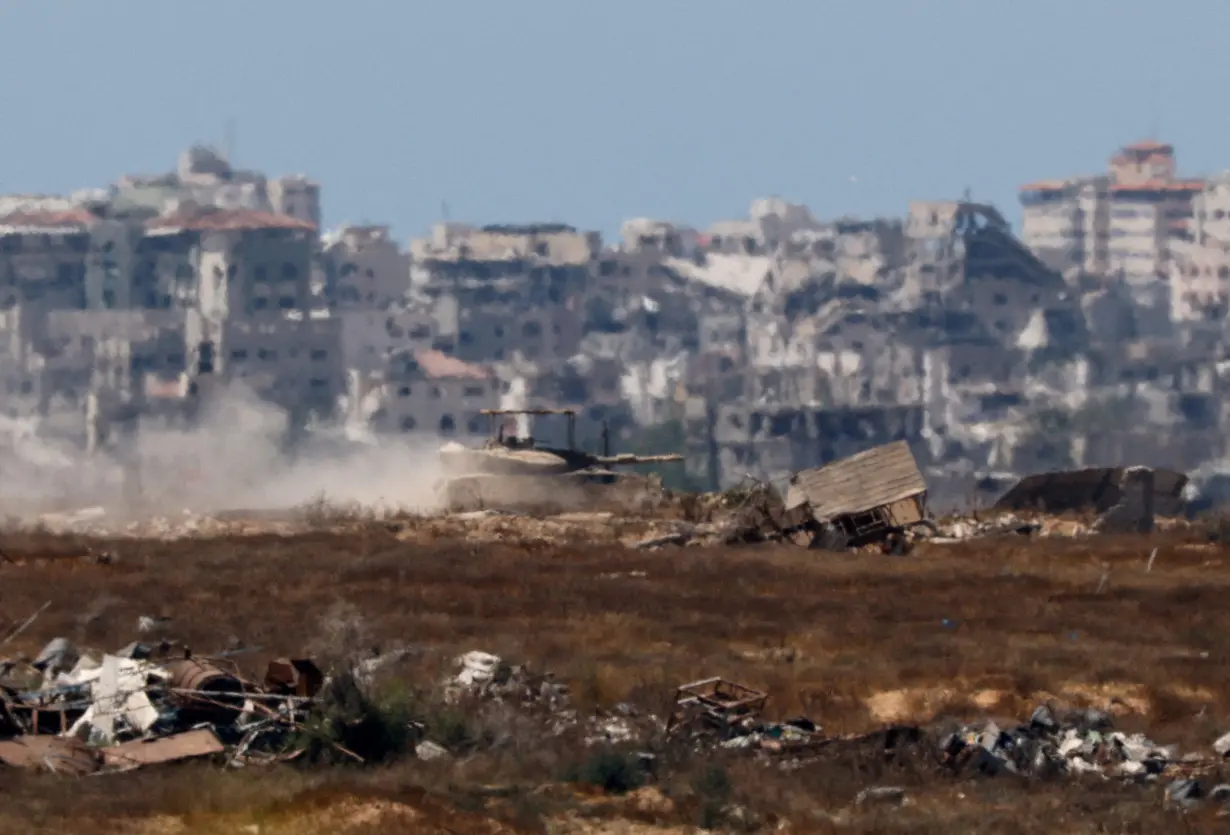 FILE PHOTO: An Israeli tank manoeuvres inside the Gaza Strip