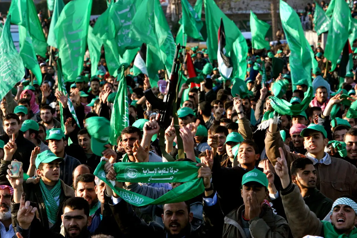 FILE PHOTO: Palestinian supporters of Hamas celebrate their victory in Palestinian election in Khan Younis