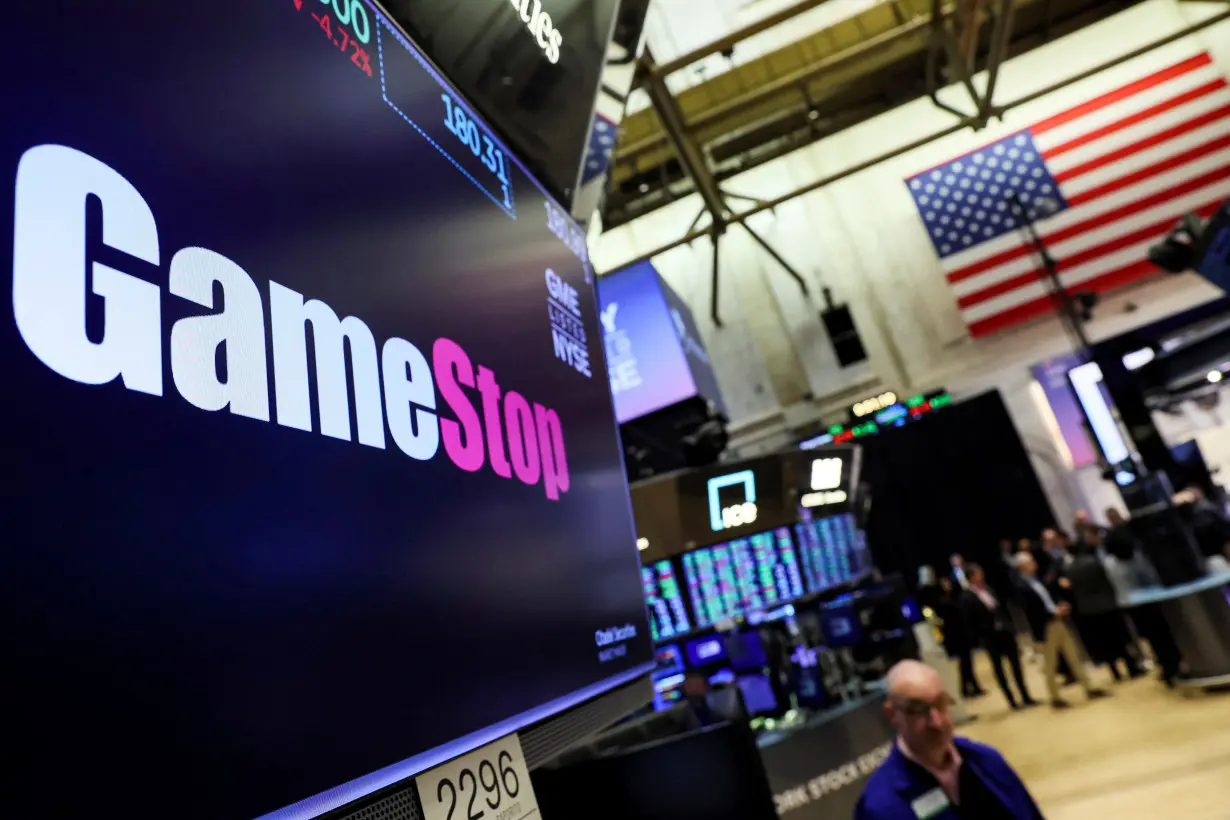 FILE PHOTO: A screen displays the logo and trading information for GameStop at the NYSE in New York