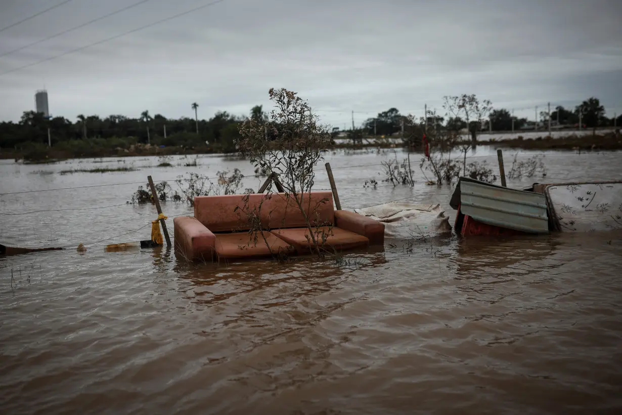 The Wider Image: Flood-battered farmers in southern Brazil wade through lost harvests