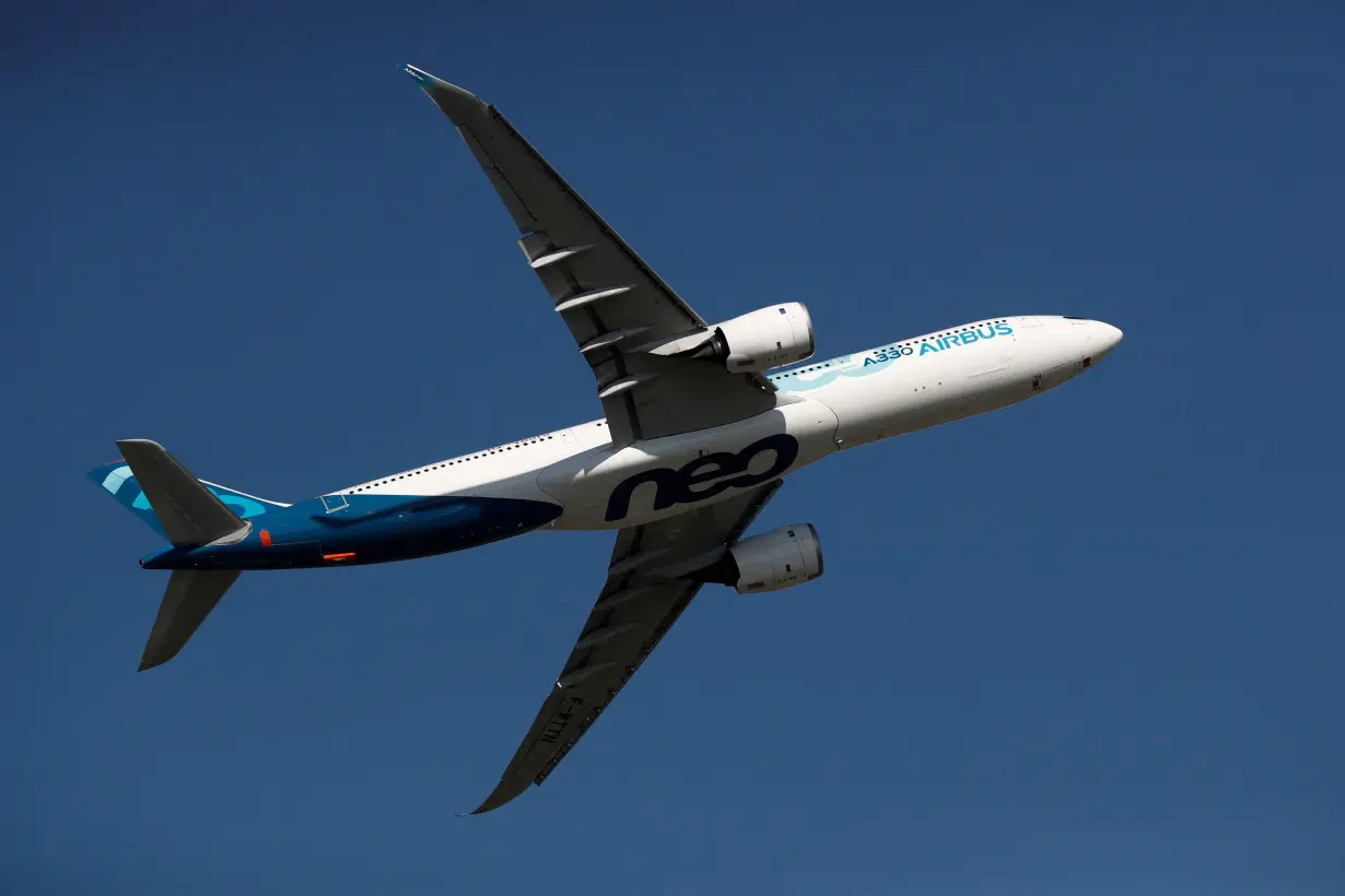 FILE PHOTO: An Airbus A330neo aircraft performs during the inauguration of the 53rd International Paris Air Show at Le Bourget Airport near Paris