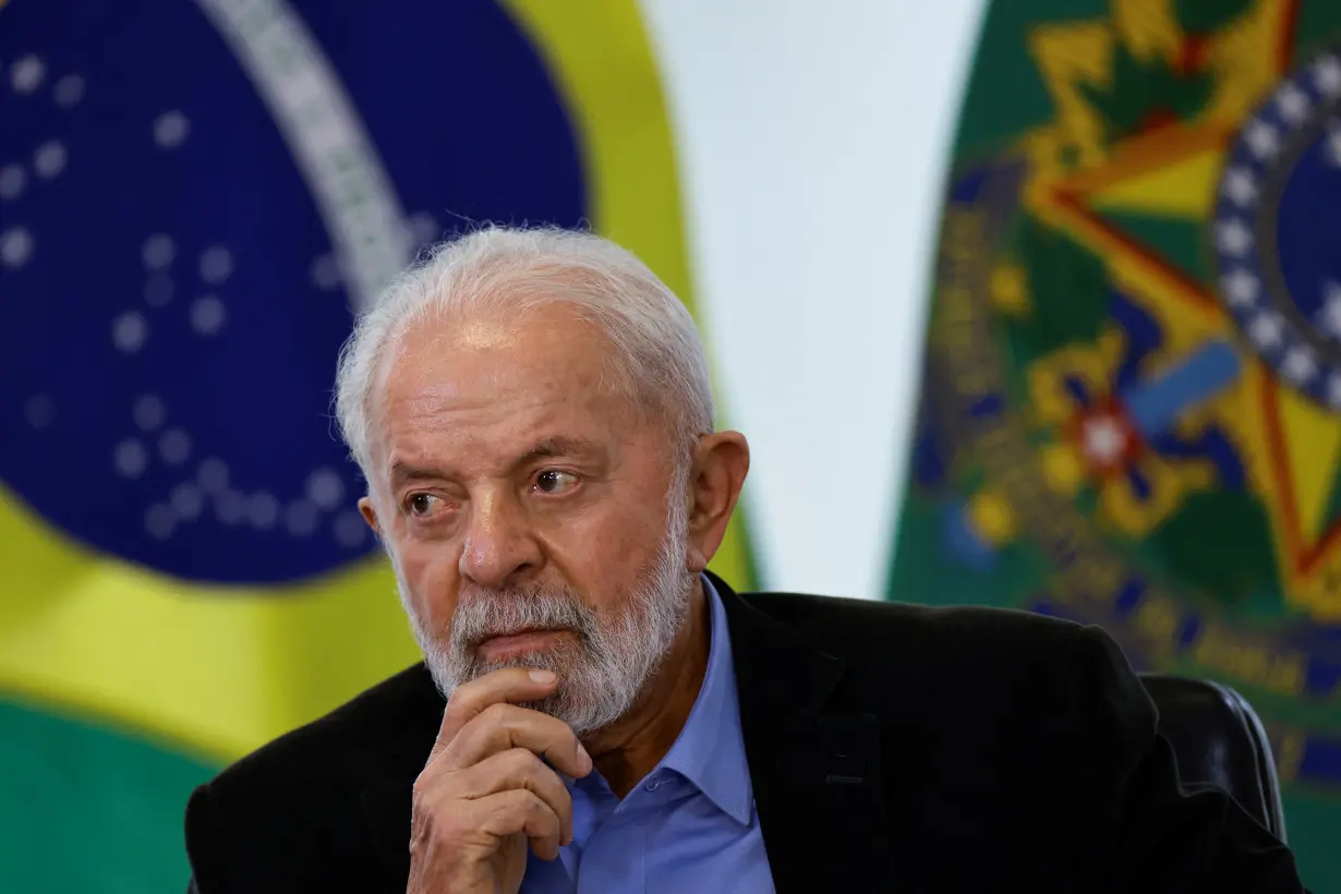 Brazil’s President Luiz Inacio Lula da Silva reacts during a meeting with members of the automotive sector in Brasilia