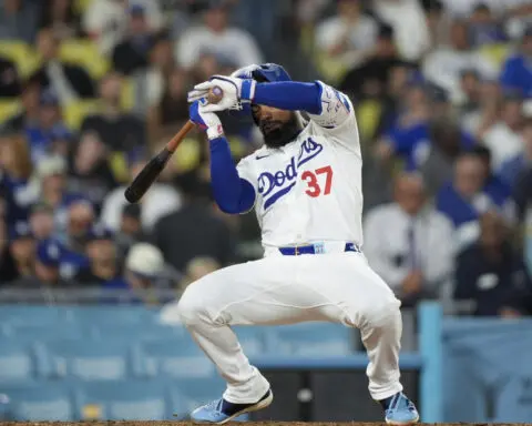 Lorenzen pitches Rangers past Dodgers 3-1 for their 1st series win in Los Angeles since 1999