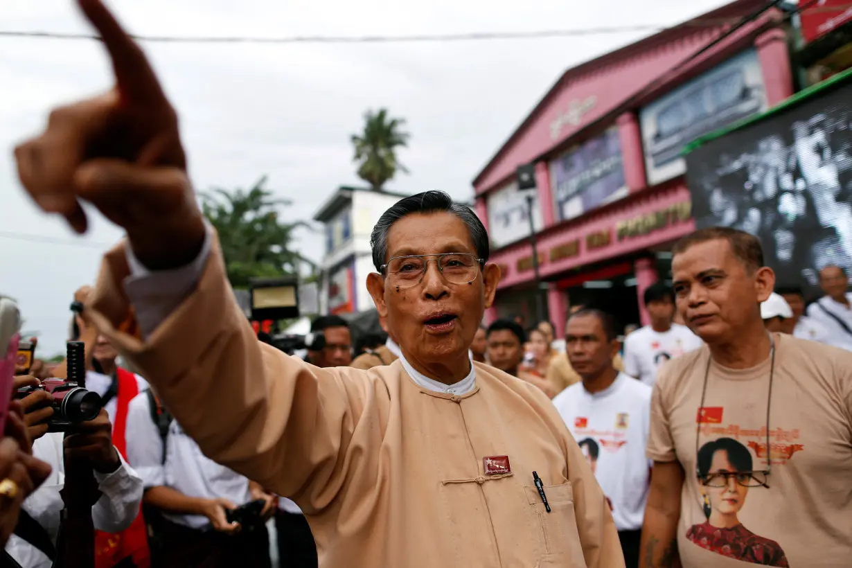 FILE PHOTO: Tin Oo, a patron of the NLD, points out other party members at a ceremony to mark the 25th anniversary of the founding of the NLD in Yangon