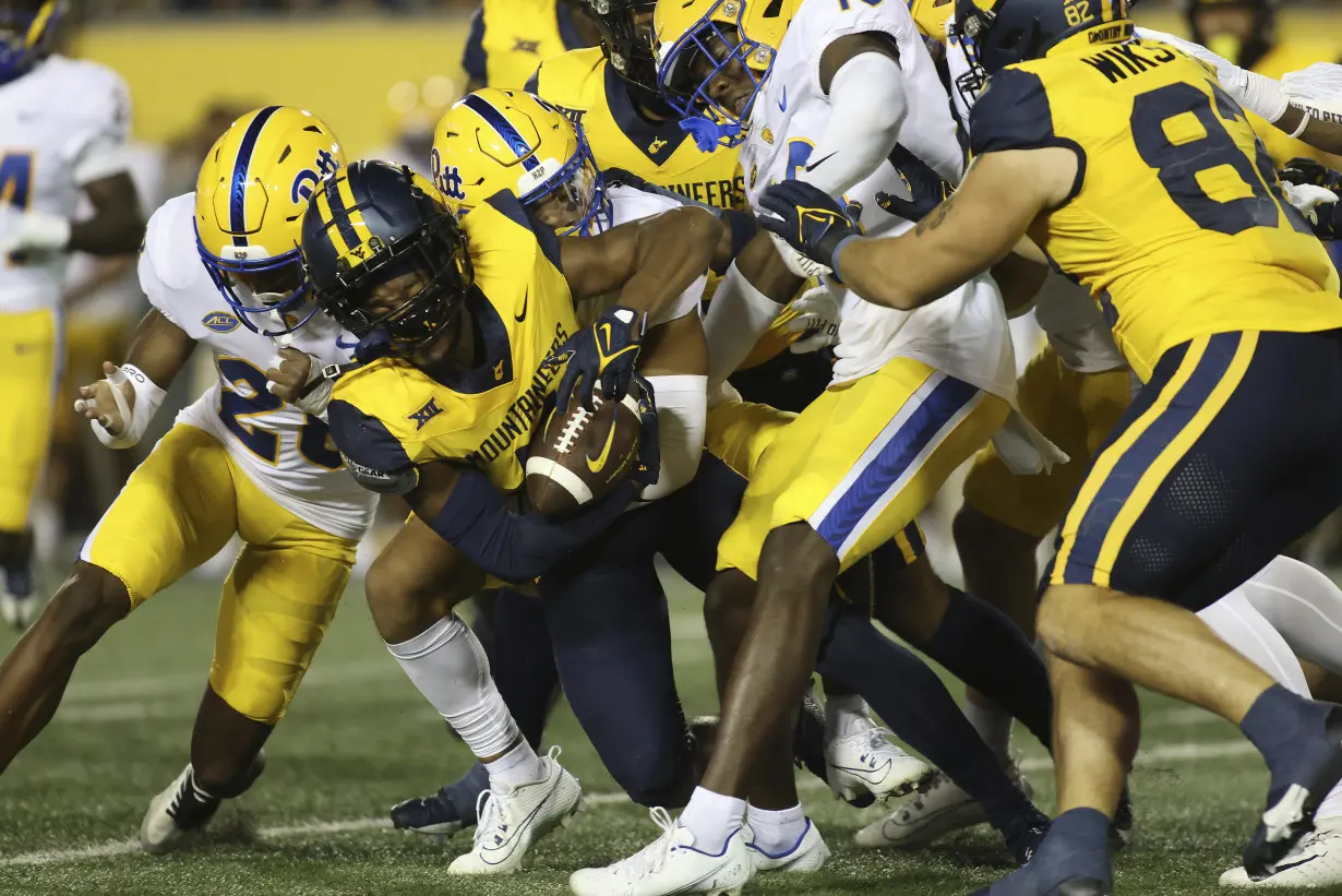 CJ Donaldson, Garrett Greene hurt in West Virginia's 17-6 win over Pittsburgh in 'Backyard Brawl'