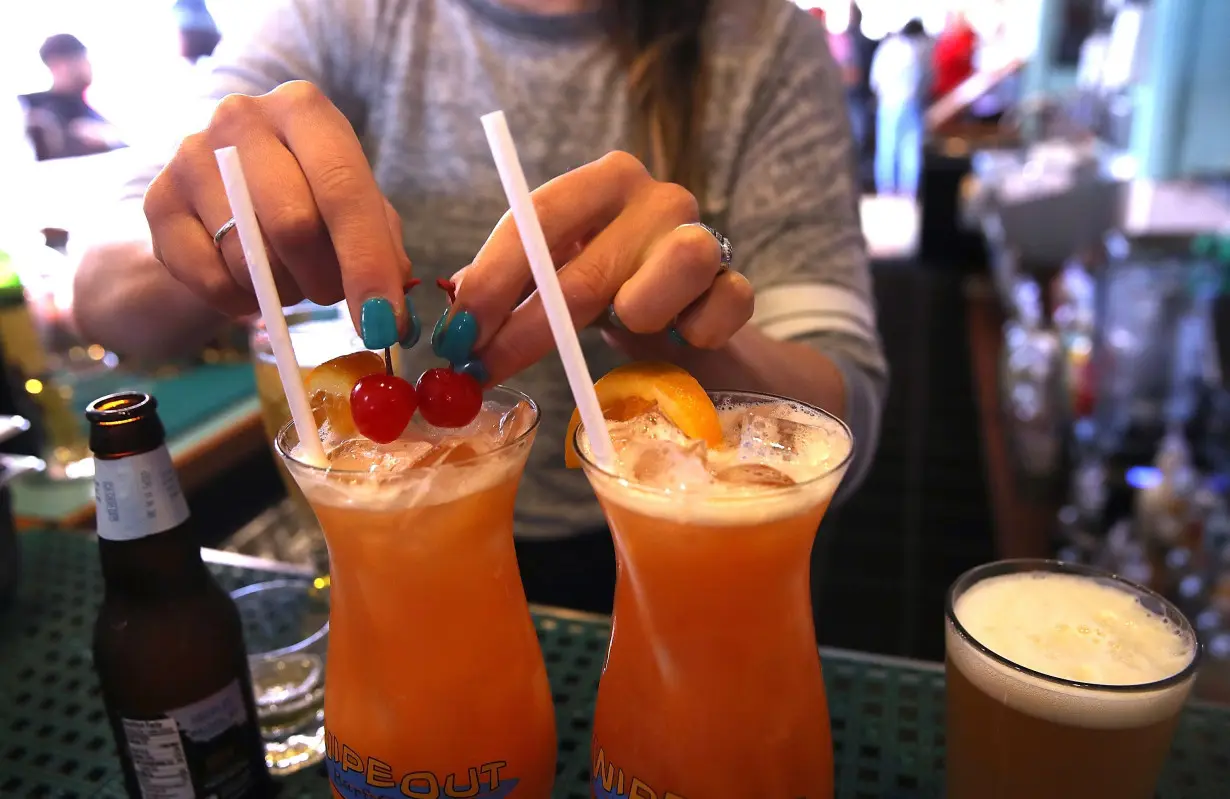 A bartender at Wipeout Bar & Grill makes cocktails on June 21, 2018 in San Francisco, California.