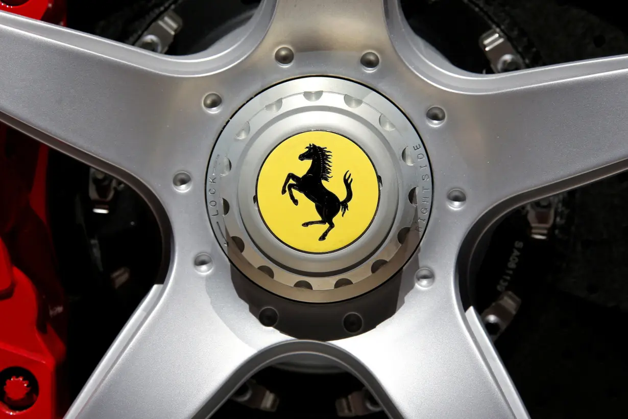 FILE PHOTO: A Ferrari logo is seen on media day at the Paris auto show, in Paris