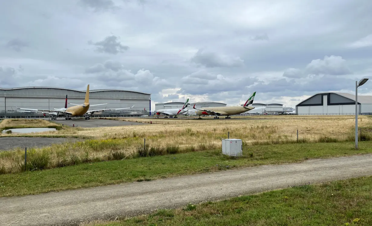 Undelivered Airbus wide-bodied jets are seen parked without engines outside the former A380 factory outside Toulouse