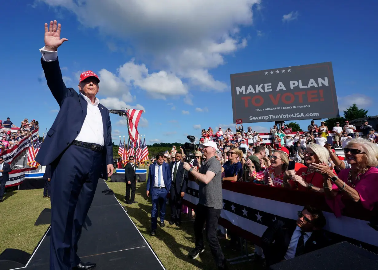 Former President Donald Trump waves to the crowd at a campaign rally in Chesapeake, Virginia, on June 28.