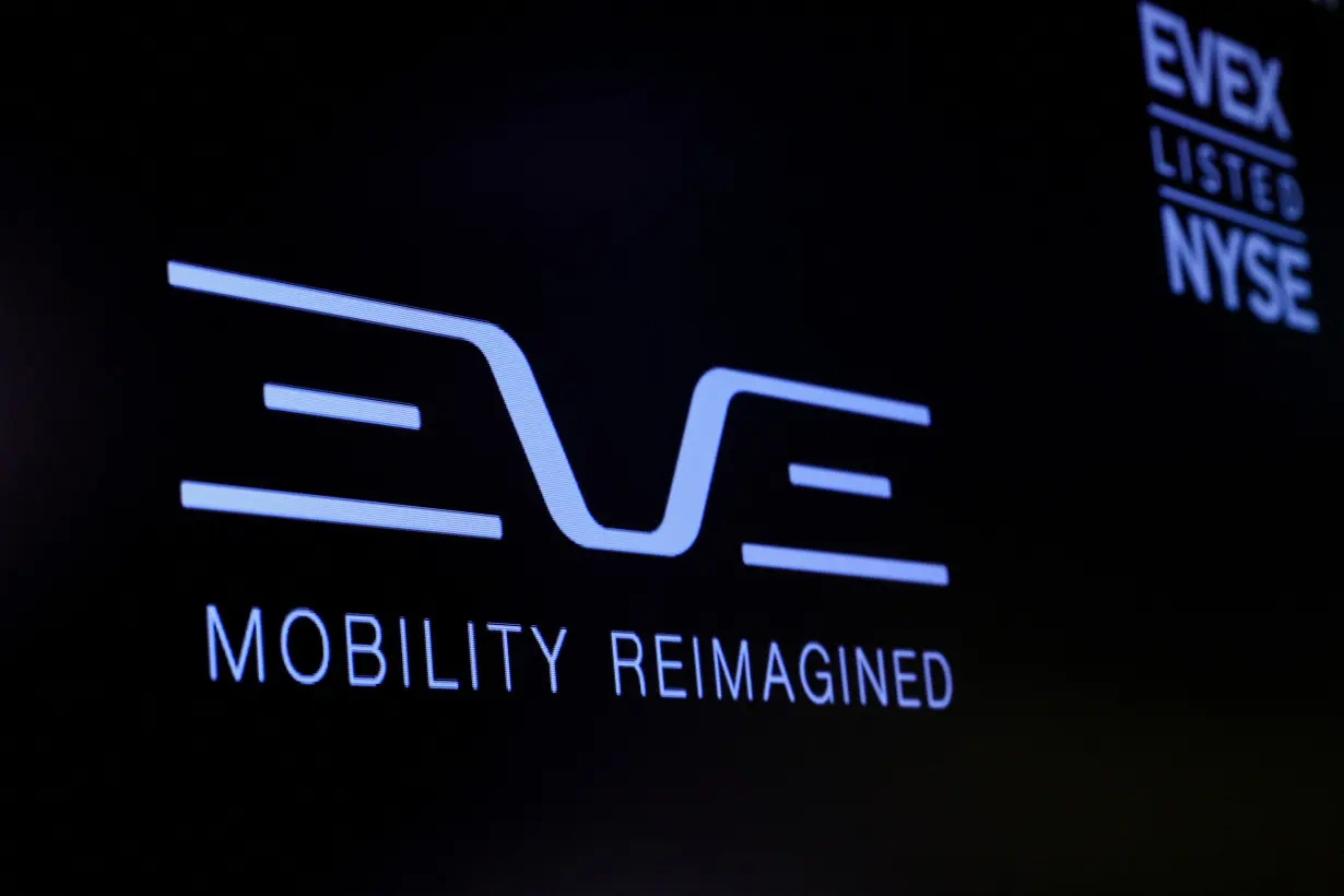 FILE PHOTO: The logo for Eve Air Mobility is displayed on a screen during the company’s debut on the floor of the NYSE in New York