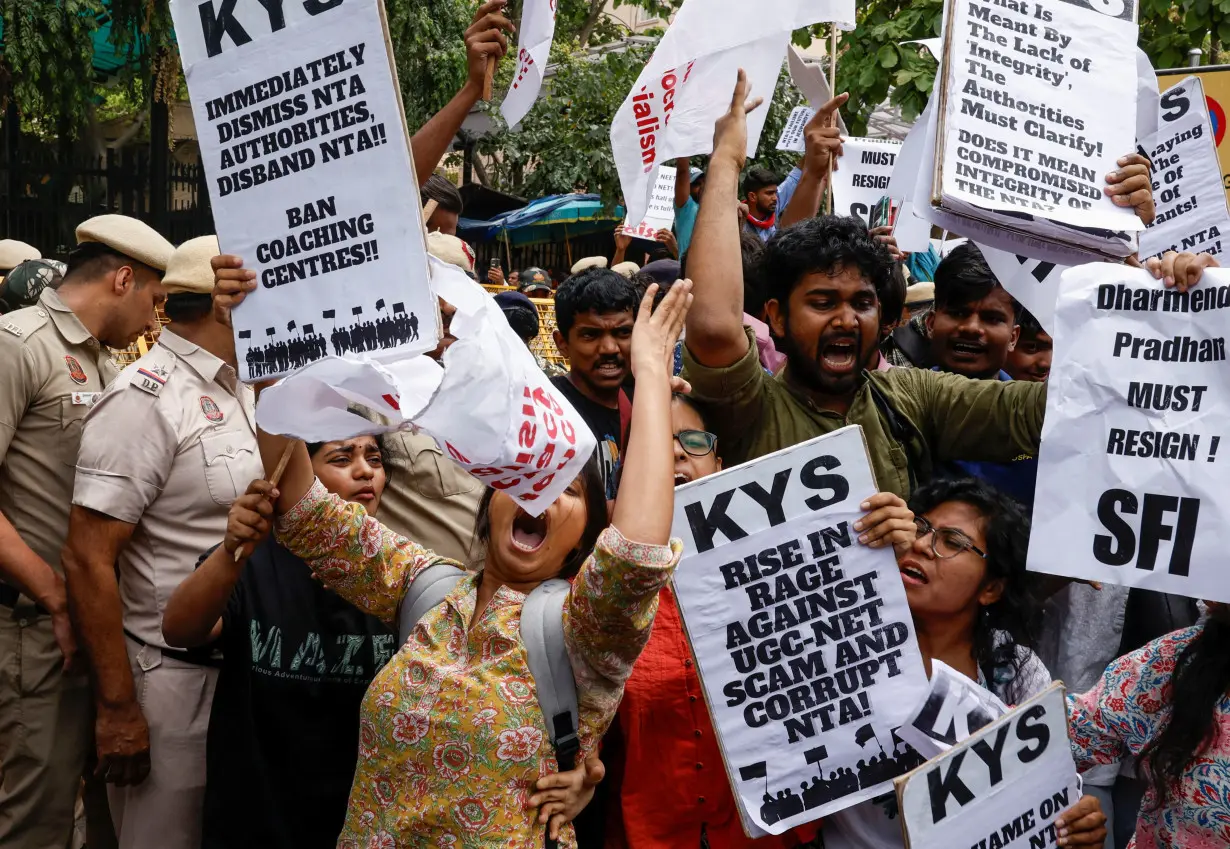 Students holding placards protest outside the Ministry of Education against the cancellation of the UGC-NET examination at New Delhi