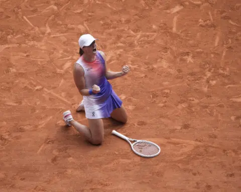 Iga Swiatek wins a third consecutive French Open women's title by overwhelming Jasmine Paolini