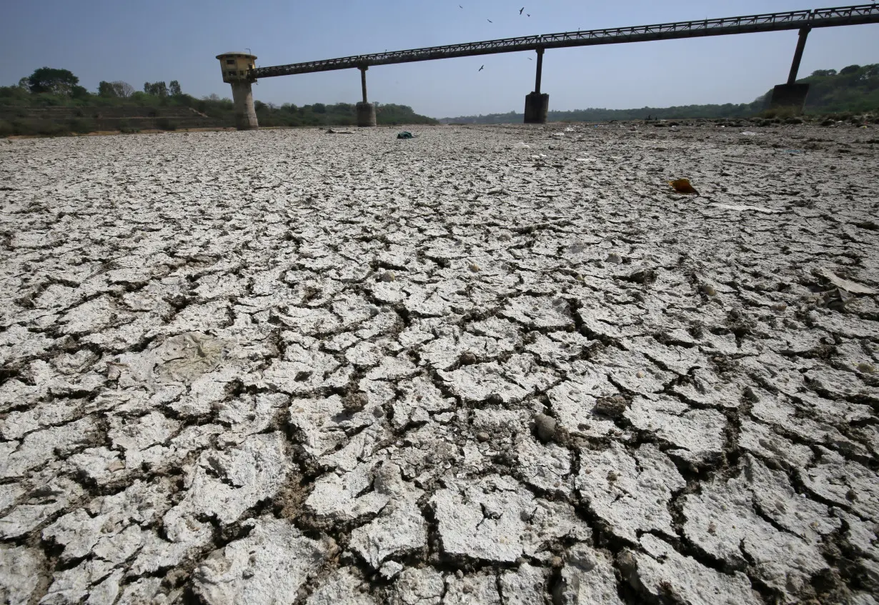 FILE PHOTO: A water pump shed is seen in the dried-up portion of the Sabarmati river on a hot day on the outskirts of Ahmedabad