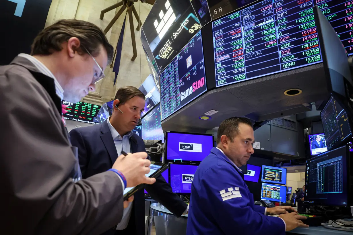 Traders work on the floor of the NYSE in New York