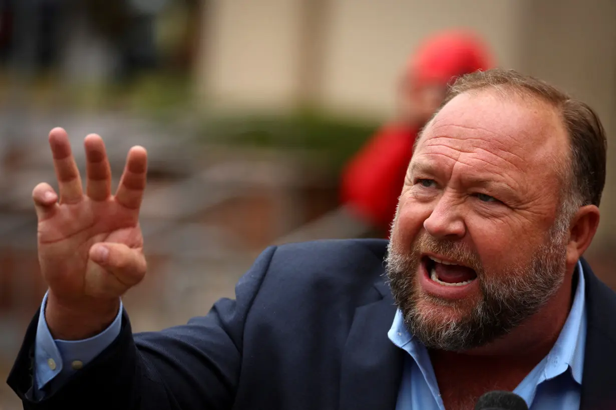 FILE PHOTO: Infowars founder Alex Jones speaks after appearing at his Sandy Hook defamation trial in Waterbury