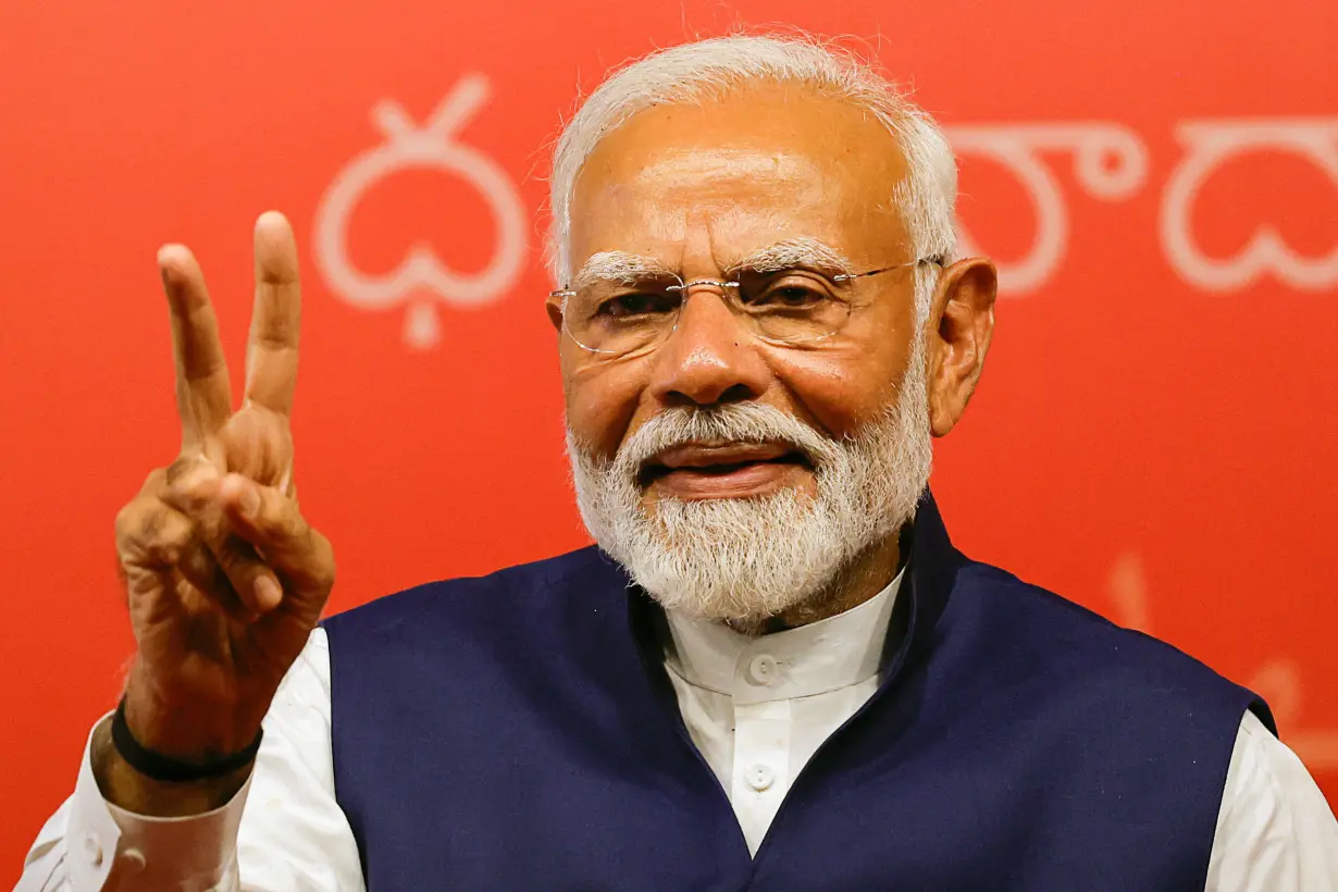 Indian PM Modi speaks to supporters at the BJP headquarters, in New Delhi