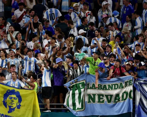 Soccer-Martinez double powers Argentina to top of Copa America Group A