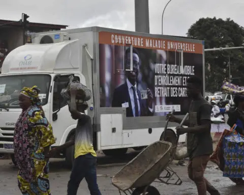 Ivory Coast sets up mobile enrollment for a health coverage program criticized over glitches