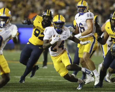 CJ Donaldson, Garrett Greene hurt in West Virginia's 17-6 win over Pittsburgh in 'Backyard Brawl'